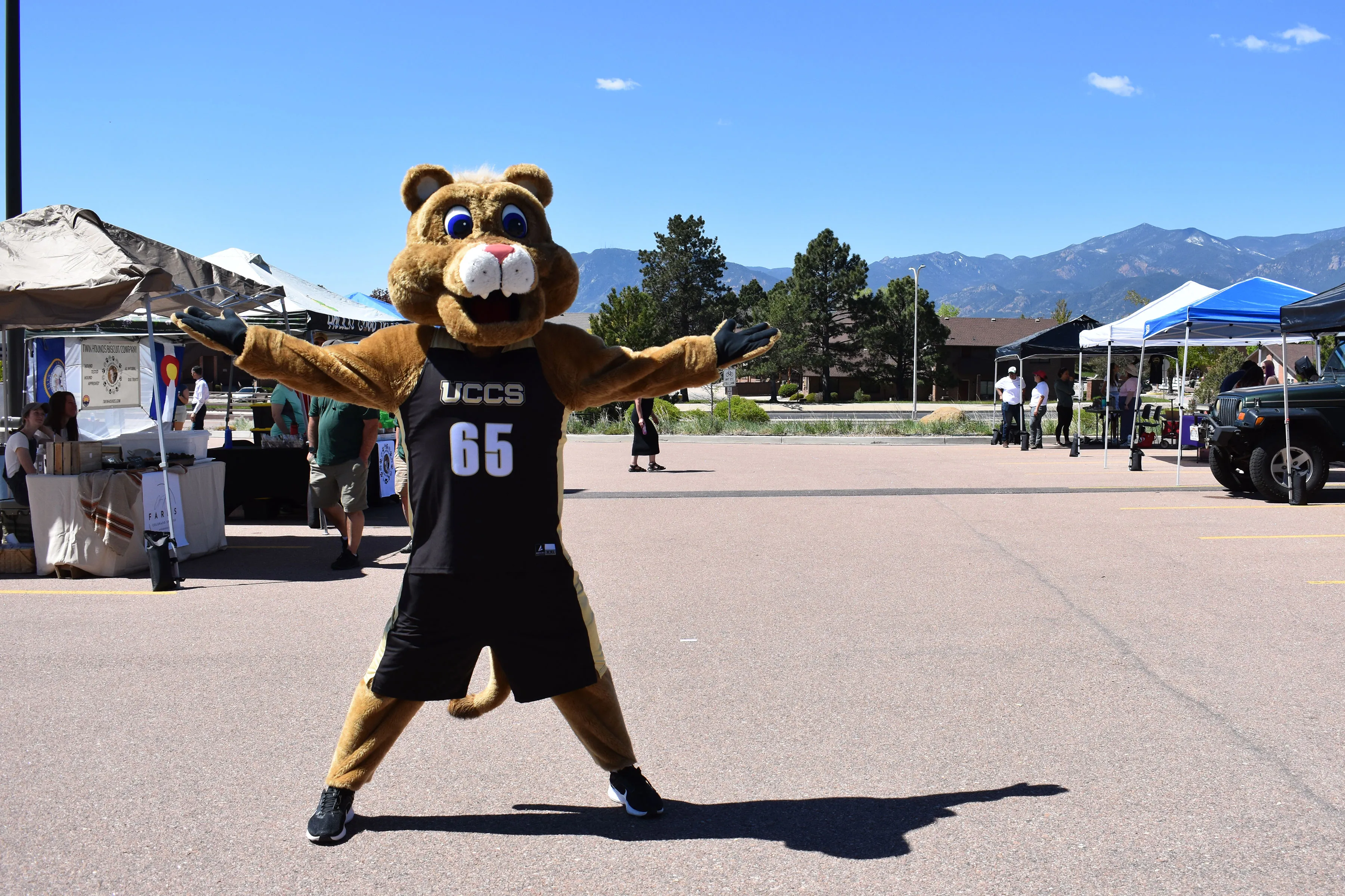 Clyde the mascot standing at the Farmers Market